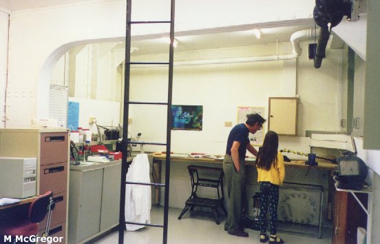 Conservator Jack Fry with a lab visitor